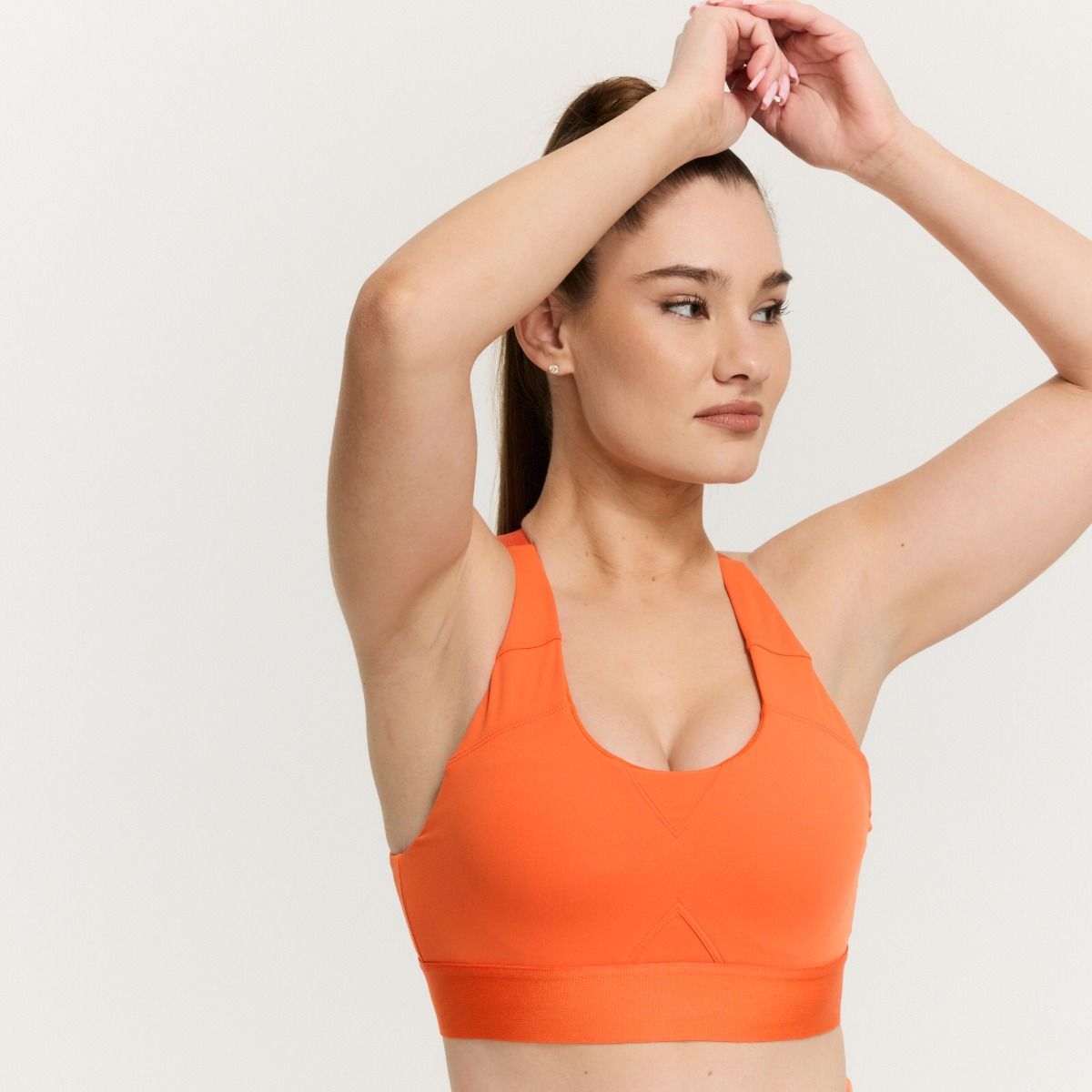 GYMBEAM - NŐI LIMITLESS SPORTMELLTARTÓ ORANGE - NARANCSSÁRGA